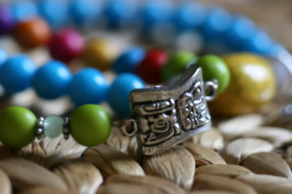 A Mayas piece photographed on a plain backdrop