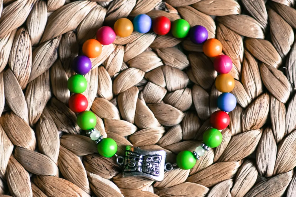 A Mayas piece photographed on a plain backdrop