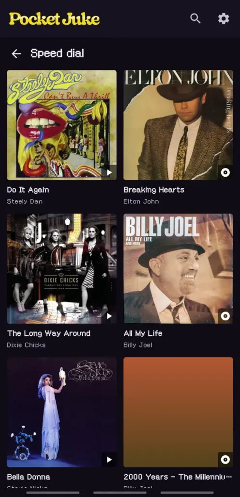 The Speed Dial see-all grid: song and album picks with cover art and Song or Album badges