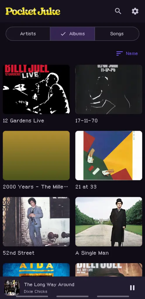 The mini player pinned under the Albums tab while a song plays