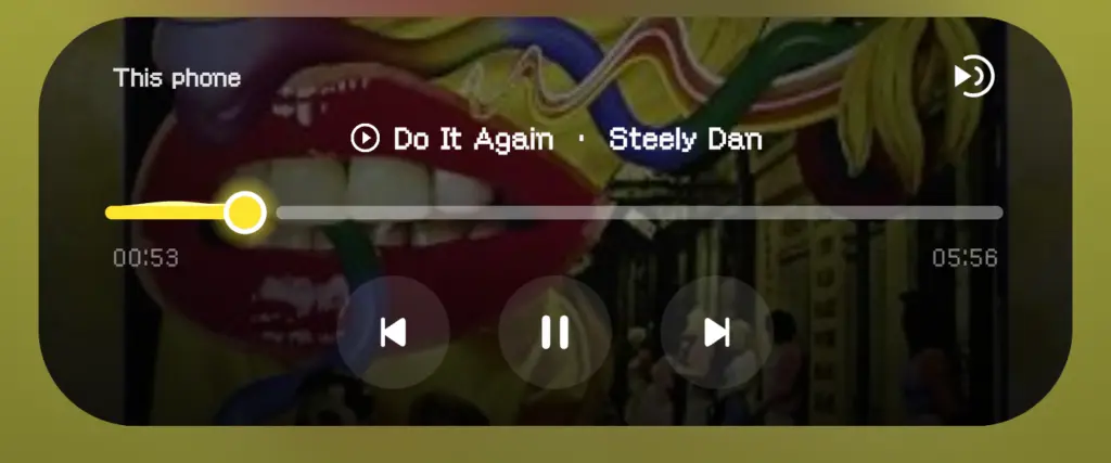 The media notification in the shade with the album artwork and the colorized card