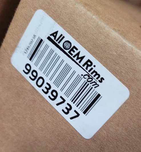 The same kind of boxed wheel carrying the later AllOEMRims.com barcode label